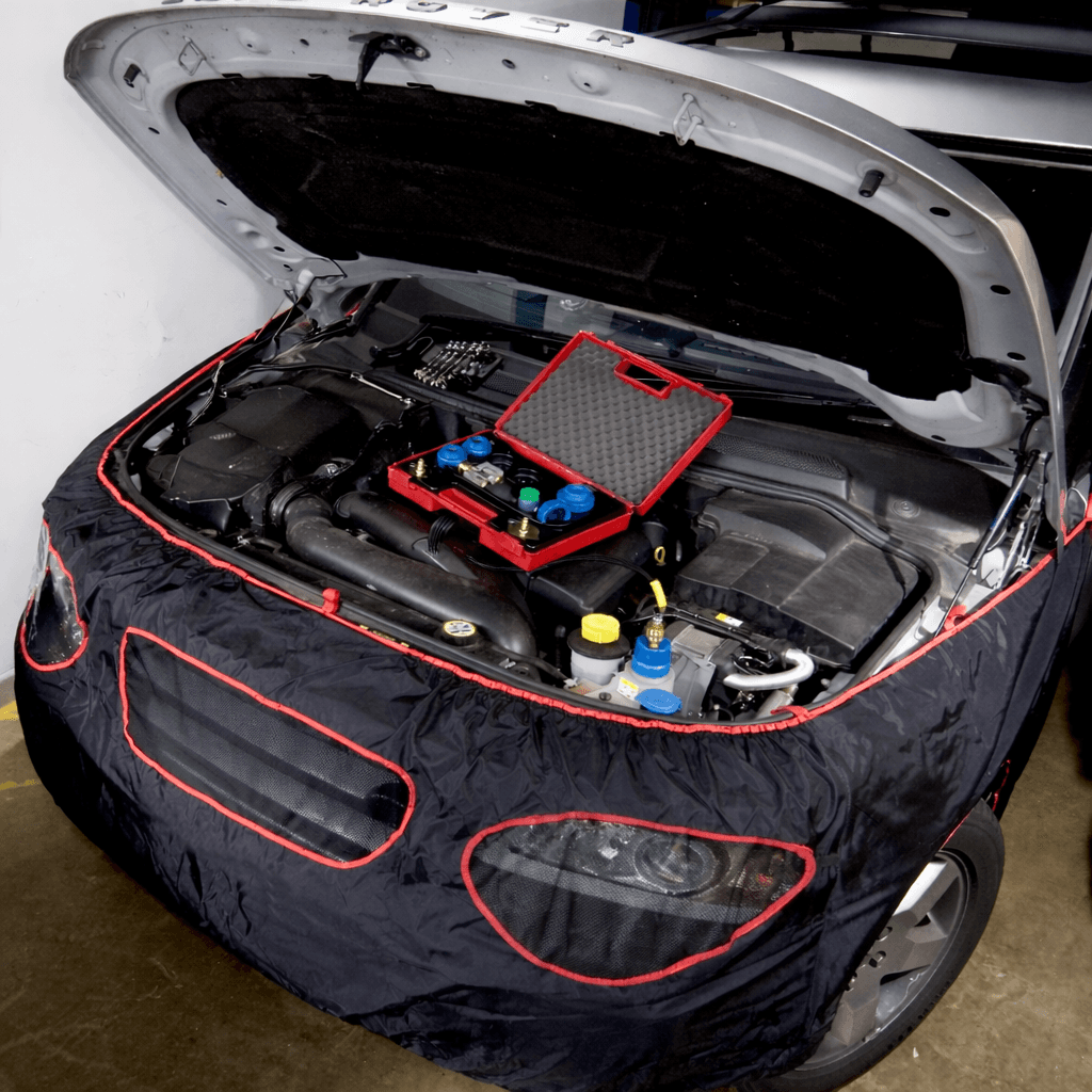 Front-end protection cover fitted around an open engine bay
